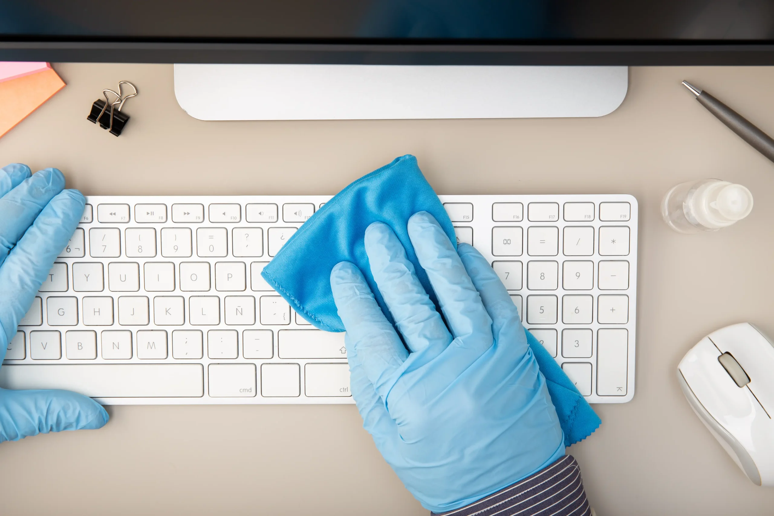 cleaning-a-white-keyboard-with-sanitizing-wipe-2026-01-08-02-37-29-utc
